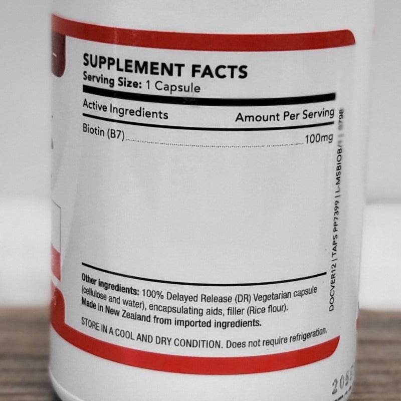 MS-Biotin Boost supplement facts label showing 100mg Biotin (B7) per capsule, ingredients, and NZ origin.