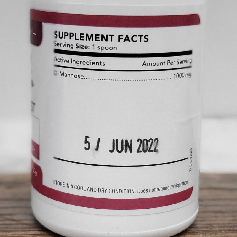 MS-Bladder Boost bottle showing supplement facts with D-Mannose 1000mg per serving and June 2022 expiry date. Helps UTIs.