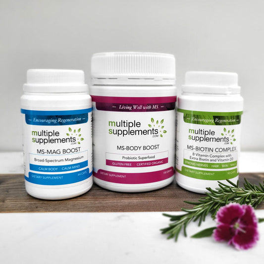MS-Starter Pack: MS-Mag Boost, MS-Body Boost, MS-Biotin Complex bottles on a rustic wooden surface with a flower.
